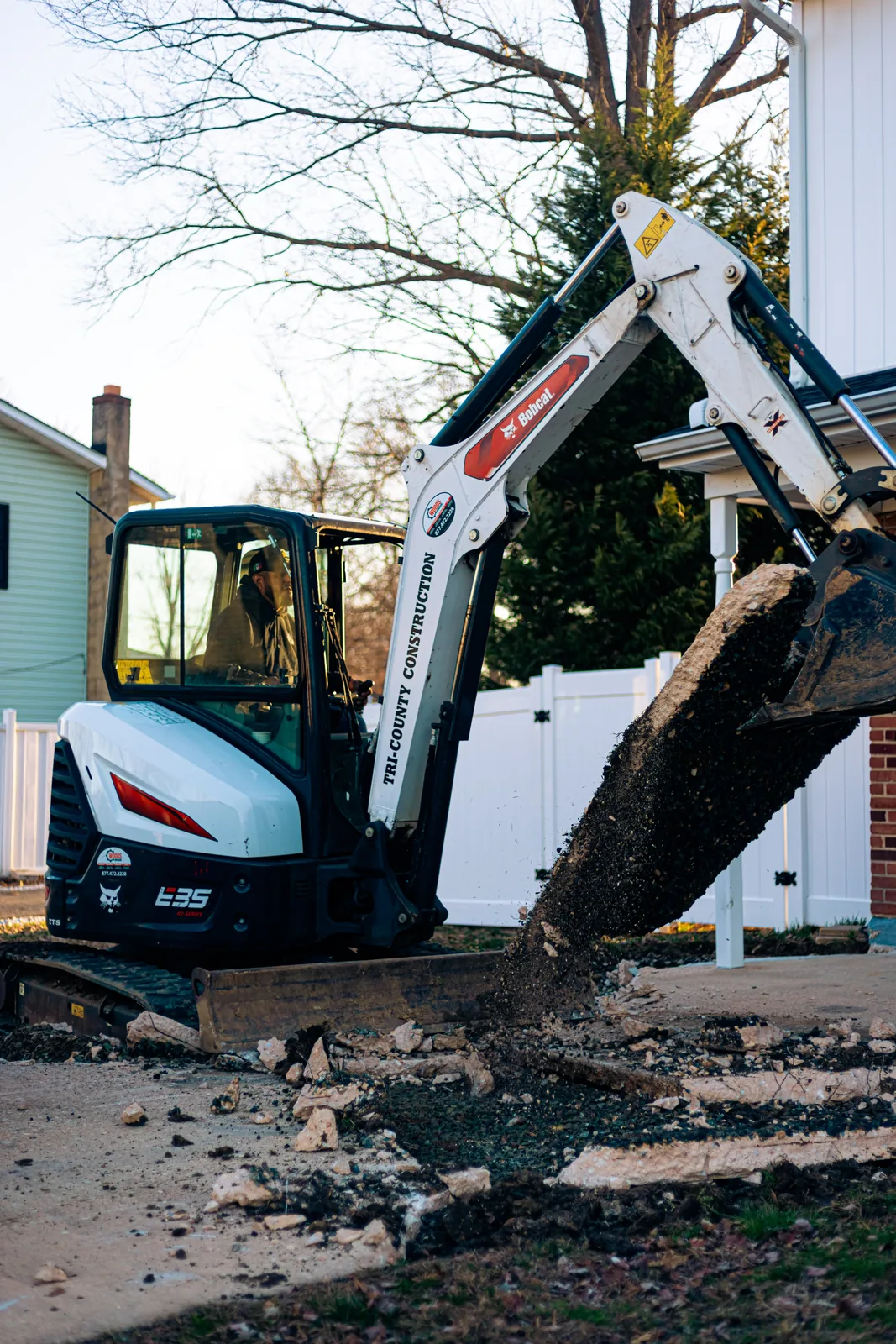 Mini excavator digging during excavation and site work in New Castle County, DE